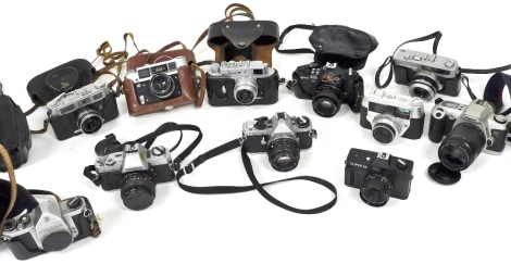 Assorted cameras, including a Pentax MEF camera, a Zorki 4 camera, Soviet Fed Four camera, and a Minolta X-300 camera. (a quantity)