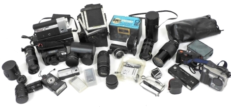 A Canon cine Canonet 8 camera, a vintage Goerz camera, camera plates, lenses, etc. (a quantity)