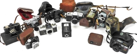 Cameras and cine cameras, including an Agfa Carat camera, a Kiev camera, Eumig cine camera, and a Kowa 15 camera. (a quantity)