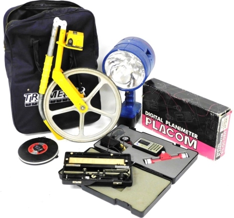 A Trumeter measuring wheel, an Allbrit Polar Planimeter, Playcom digital Planimeter, and a Draper RHL185 portable halogen lamp. (4)