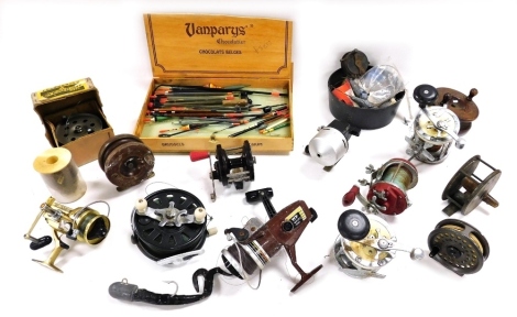 Assorted fishing reels, including an Intrepid rim fly reel, Garcia Mitchell 624 boat reel, and a Captain Mitchell 624 reel, Intrepid Sea Streak reel, and a Featherflo strike right reel, together with floats, lead weights, etc.