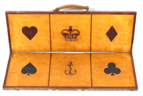 A late 19thC crown and anchor wooden and inlaid folding board, showing the four playing card suits, 63cm wide.