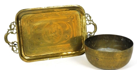 An early 20thC Eastern brass bowl, partially decorated, 26cm diameter, and an elaborate tray with pierced handles. (2)