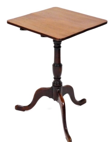 A Georgian mahogany tilt top occasional table, with a square top over a turned baluster column, over three slender cabriole legs, 69.5cm high, 45cm wide.