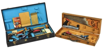 A carpenter's tool chest, containing a record number 123 drill, Stanley number 3 plane, number 19 set square and further tools, 66.5cm wide, and a further tool chest, fitted with tools, 97.5cm wide. (2)