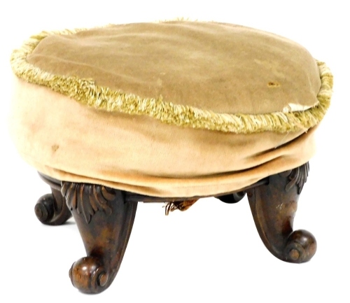 A 19thC circular mahogany stool, upholstered in fawn coloured draylon, raised on four leaf carved cabriole legs, 48cm wide.