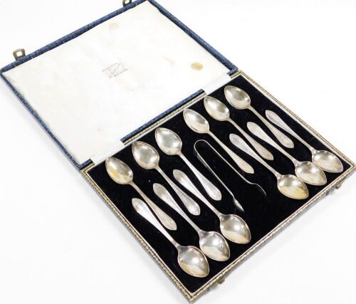 A set of twelve George VI silver teaspoons and sugar tongs, in fitted box, Sheffield 1941, 5oz.