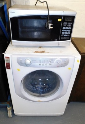 A Hotpoint Aqualtis 7.5kg washing machine, and a Logik microwave.