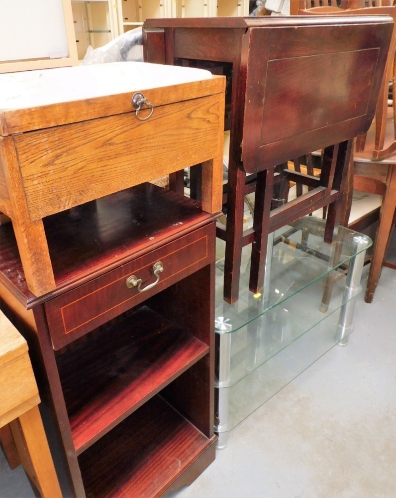 A group of furniture, to include a glass three tier television stand