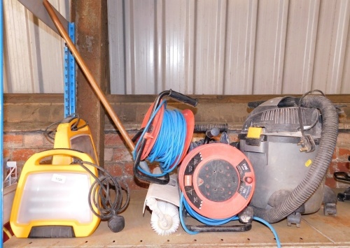 Two portable lights, extension leads, vacuum cleaner, etc. Note: VAT is payable on the hammer price of this lot at 20%.Buyer Note: WARNING! This lot contains untested or unsafe electrical items. It is supplied for scrap or reconditioning only. TRADE ONLY