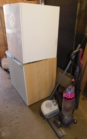 Two cupboards, fireplace, Dyson vacuum cleaner, heater and brush. Note: VAT is payable on the hammer price of this lot at 20%.