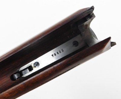 An over and under 12 bore shotgun, with ejector, by Simson Suhl (DR), engraved with a gun dog and hare and scrolling ornamentation, barrels 71cm NB. A current valid Registered Firearms Dealer Certificate will be required to view and bid for this lot. Fo - 9