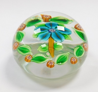 A Paul Ysart floral glass paperweight, decorated with a turquoise five petal flower, within a surround of green leaves and orange millefiori, PY cane, 7.5cm wide. - 3