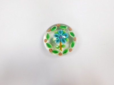 A Paul Ysart floral glass paperweight, decorated with a turquoise five petal flower, within a surround of green leaves and orange millefiori, PY cane, 7.5cm wide. - 4