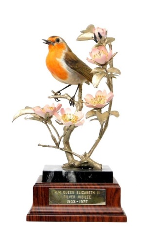 An Albany Fine China Robin ornament, on a marble plinth on wooden base, with plaque 'H M Queen Elizabeth II Silver Jubilee 1952-1977', limited edition 9 underside, 31cm high.