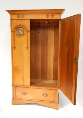 A Victorian Art Nouveau satin birch single wardrobe, the out swept pediment above a foliate carved frieze, single mirrored door, flanked to the left with a material backed circular pane panel, over one long frieze drawer, raised on bracket feet, 201cm hig - 2