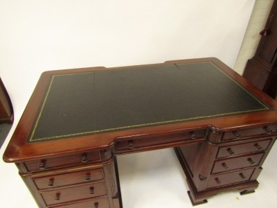 A Victorian style mahogany twin pedestal desk, the break front top with gilt tooled black leather inset, over three drawers, two pedestals each with three graduated drawers, raised on ogee bracket feet, 75.5cm high, 150cm wide, 93cm deep. - 2