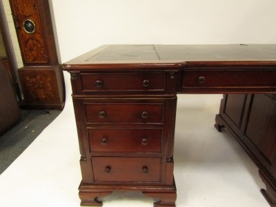 A Victorian style mahogany twin pedestal desk, the break front top with gilt tooled black leather inset, over three drawers, two pedestals each with three graduated drawers, raised on ogee bracket feet, 75.5cm high, 150cm wide, 93cm deep. - 3