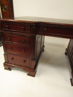 A Victorian style mahogany twin pedestal desk, the break front top with gilt tooled black leather inset, over three drawers, two pedestals each with three graduated drawers, raised on ogee bracket feet, 75.5cm high, 150cm wide, 93cm deep. - 4