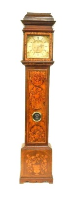 A William & Mary walnut and marquetry longcase clock, with caddy top hood, full length trunk door with bulls-eye glass, with marquetry reserves of birds and flowers, later decorated base, the square brass dial with amorini spandrels, silvered chapter ring