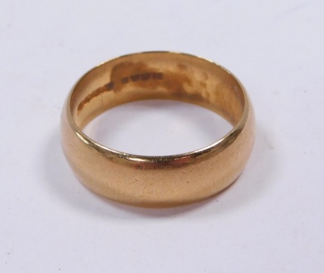 A 22ct gold wedding band, of plain design, Birmingham 1818, 10.6g.