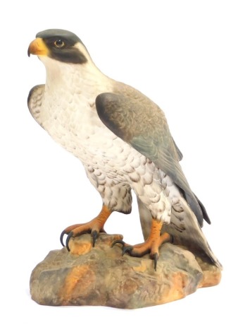 A Royal Crown Derby matt glazed Falcon, signed S L Beardsall, printed marks, 24cm high, boxed.