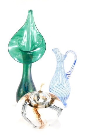 An Alum Bay green lustre Jack-in-the-Pulpit vase, bears paper label, 41cm high, together with a Peschec glass jug, of baluster form, with blue and white banded decoration, etched mark, 25cm high, and a glass weight form oil lamp, with internal brown and b