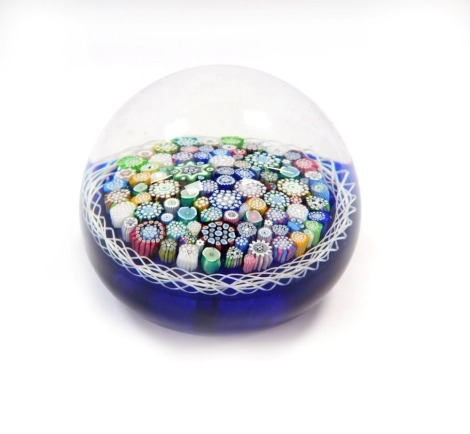 A John Deacons silhouette millefiori paperweight, blue ground, dated 2006, bears paper label, 8cm diameter.