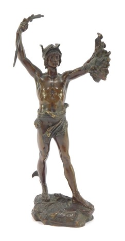 After Jules Edouard Roine. A bronze figure of Perseus holding the head of Medusa, raised on a naturalistic base with banner, named 'Persee Petrifiant Atlas' verso a stamp for the Exposition, Paris 1900, 24cm high.