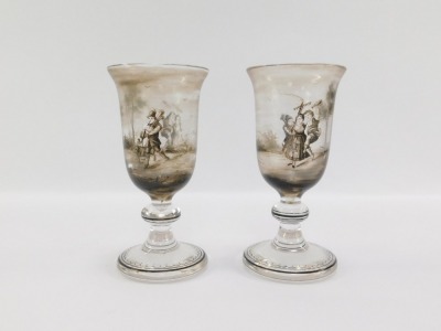 A pair of early 19thC Continental wine glasses, the trumpet shaped bowl painted in shades of grey with pastoral figures in a landscape, on a banded and teardrop included single knop stem, raised on an outswept conical foot, 16cm high. - 3