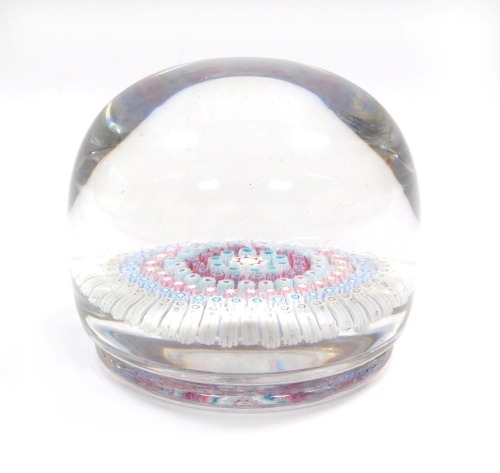 A late 19thC concentric millefiori glass paperweight, possibly Richardsons, of domed and footed form, 9cm diameter.