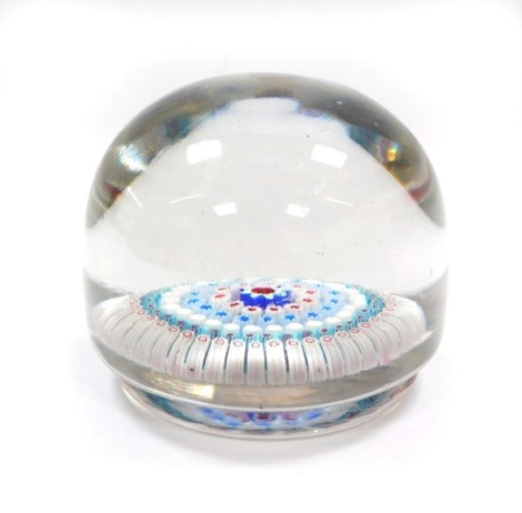 A late 19thC concentric millefiori glass paperweight, possibly Richardsons, of domed and footed form, 9cm diameter.