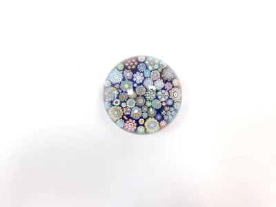 A Peter McDougall millefiori glass paperweight, blue ground with PMCD cane and paper label, 6cm diameter. - 2