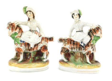 A pair of Staffordshire mid 19thC pottery figures, modelled as the Prince of Wales and Princess Royal, mounted riding on goats, raised on a naturalistic oval base, 19cm high.