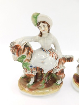 A pair of Staffordshire mid 19thC pottery figures, modelled as the Prince of Wales and Princess Royal, mounted riding on goats, raised on a naturalistic oval base, 19cm high. - 2