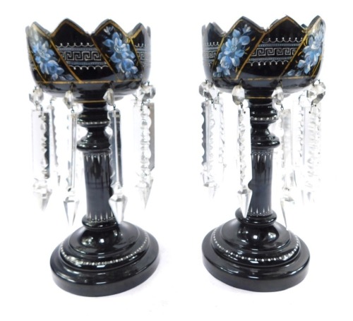 A pair of late 19thC glass lustres, painted floral and enamelled decoration, with clear glass prismatic drops, black, but deep red when held to the light, 33cm high.