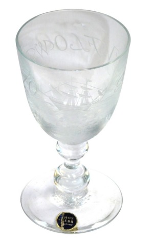 A Thomas Webb commemorative wine glass, engraved Mayflower 70, with the ship and figures, signed C C Kimberley, limited edition no. 2, raised on a double knop stem and conical foot, bears paper label and etched mark, 15.5cm high.