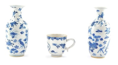 A pair of Qing Dynasty late 19thC blue and white porcelain vases, of shouldered ovoid form, painted with birds, butterflies, fruit and flowers, bears four character mark, 15cm high, together with a late 18thC porcelain coffee cup, decorated in blue and wh