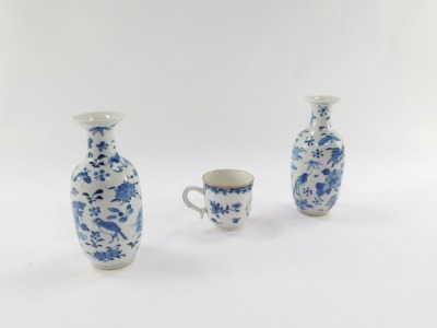 A pair of Qing Dynasty late 19thC blue and white porcelain vases, of shouldered ovoid form, painted with birds, butterflies, fruit and flowers, bears four character mark, 15cm high, together with a late 18thC porcelain coffee cup, decorated in blue and wh - 2