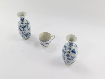 A pair of Qing Dynasty late 19thC blue and white porcelain vases, of shouldered ovoid form, painted with birds, butterflies, fruit and flowers, bears four character mark, 15cm high, together with a late 18thC porcelain coffee cup, decorated in blue and wh - 3