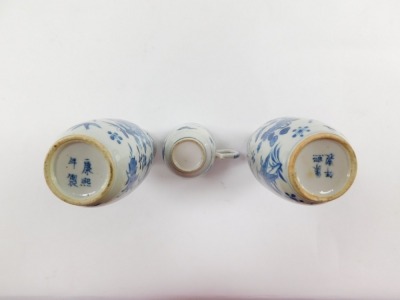 A pair of Qing Dynasty late 19thC blue and white porcelain vases, of shouldered ovoid form, painted with birds, butterflies, fruit and flowers, bears four character mark, 15cm high, together with a late 18thC porcelain coffee cup, decorated in blue and wh - 4