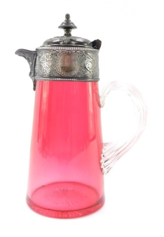 A Victorian cranberry glass claret jug, with an engraved silver plated mount and hinged lid, on a clear twisted glass handle, 23cm high.