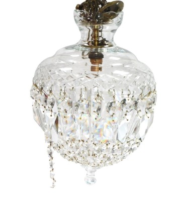 An early 20thC cut glass bag chandelier, with brilliant and prismatic cut drops, with brass hanging hook, 33cm high.