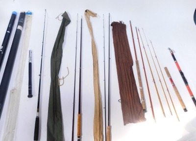 A group of fishing rods, comprising Shakespeare Sigmo boat 1470/020, split cane rod, red split cane rod, fibre glass rod, etc. (a quantity)