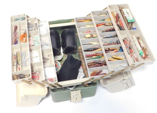 A fishing tackle box and contents, to include flies and lures, etc.