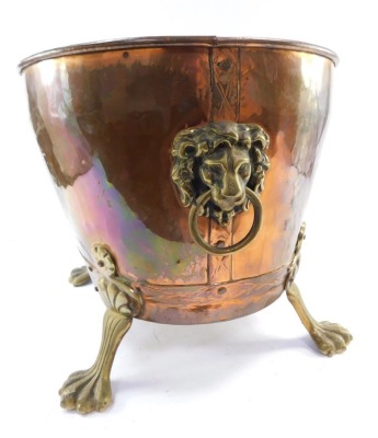 A Victorian copper and brass log basket, the shaped oval basket, on claw feet with lion mask and ring handles, 33cm high, 44cm wide. - 3