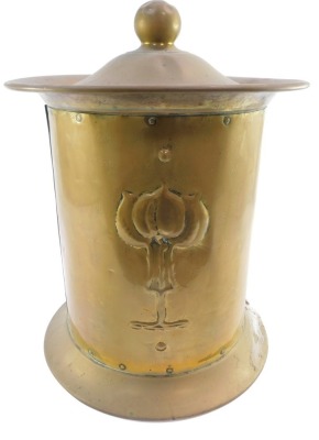 An Art Nouveau brass coal bucket, with shaped lid on flared rim, with Art Nouveau applied motif, 44cm high.