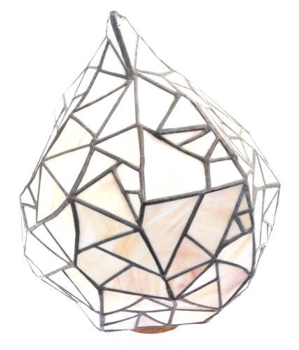 A Tiffany style lamp shade, of abstract design, with cream geometric panels, 50cm high.