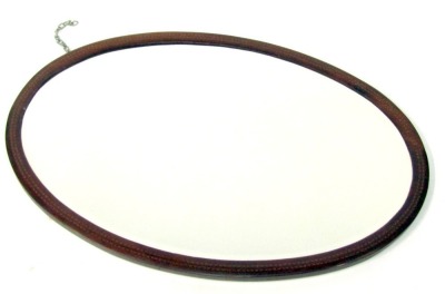 An Edwardian mahogany oval wall mirror, with line inlay, 94cm x 66cm.