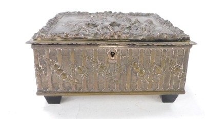 A late 19thC silver plated sewing box, the rectangular top with raised relief figures of cherubs, trees and flowers, opening to reveal a mustard lined interior, with bee stamp and double G to underside, 8cm high, 17cm wide, 12cm deep. - 2